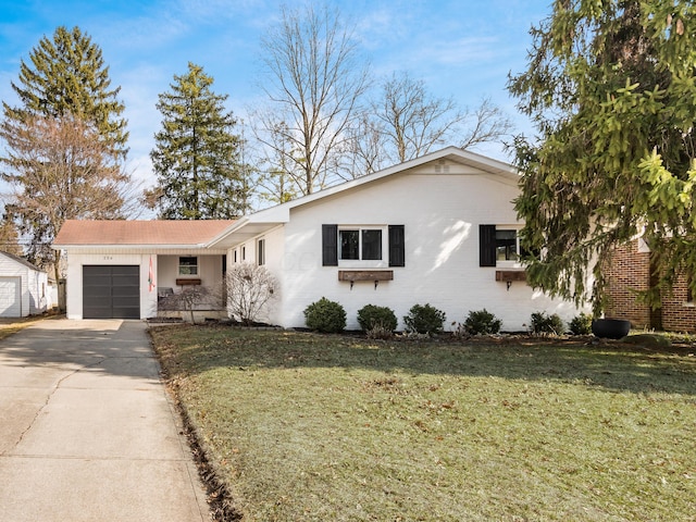 ranch-style home with concrete driveway, a front lawn, an attached garage, and brick siding