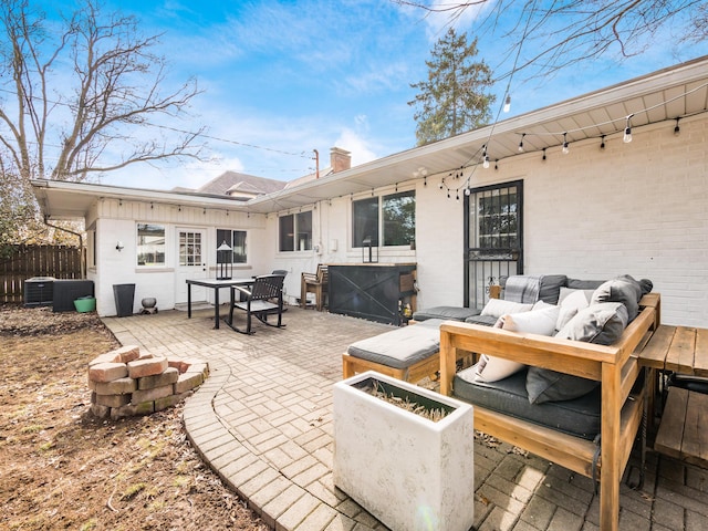 view of patio with fence, outdoor lounge area, and cooling unit