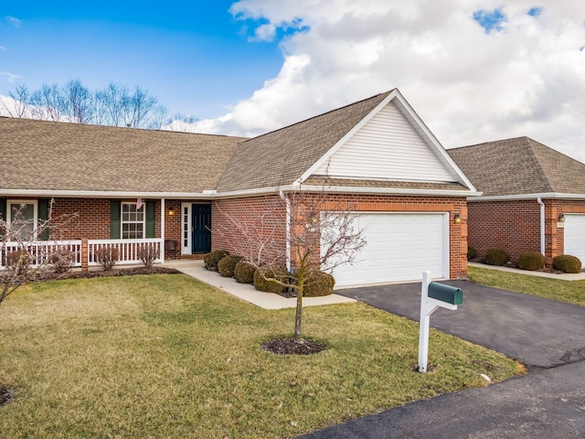 ranch-style house with brick siding, a shingled roof, aphalt driveway, covered porch, and an attached garage