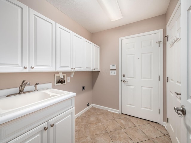 laundry area with hookup for a washing machine, light tile patterned floors, baseboards, hookup for an electric dryer, and cabinet space