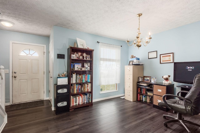 office featuring dark wood finished floors, a textured ceiling, baseboards, and an inviting chandelier