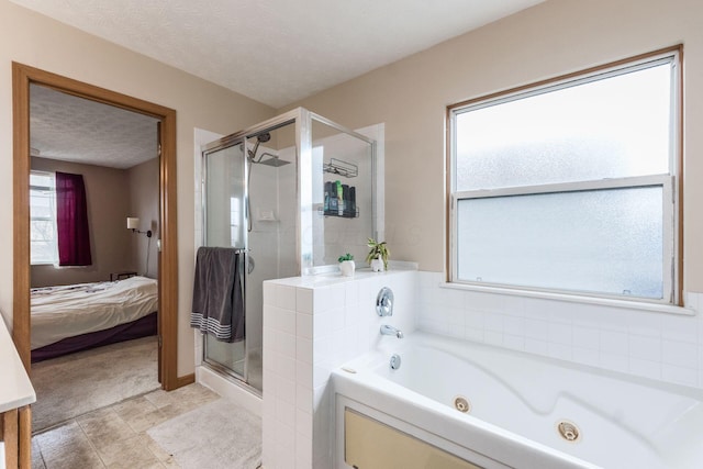 ensuite bathroom with a stall shower, connected bathroom, a textured ceiling, and a whirlpool tub