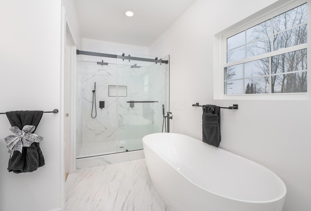 full bath with recessed lighting, marble finish floor, a freestanding bath, and a marble finish shower