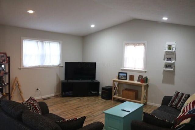 living room with vaulted ceiling, wood finished floors, and recessed lighting