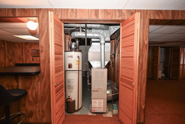 utility room featuring gas water heater