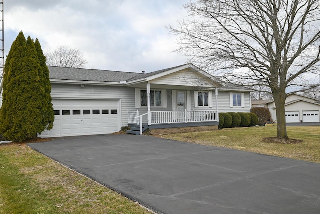 single story home with roof with shingles, covered porch, an attached garage, a front yard, and driveway