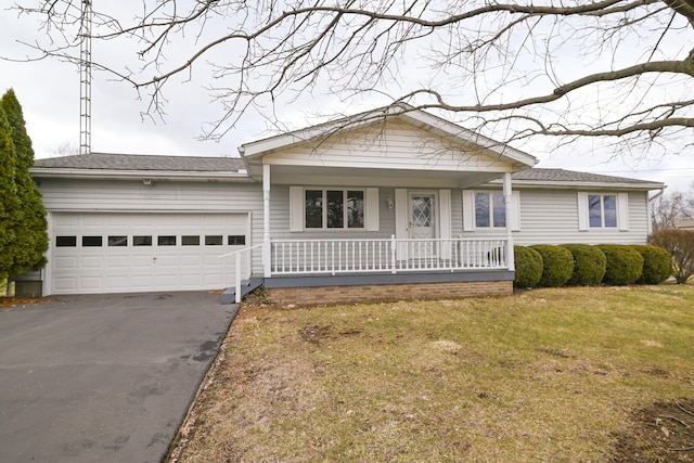 single story home featuring driveway, covered porch, a garage, and a front lawn