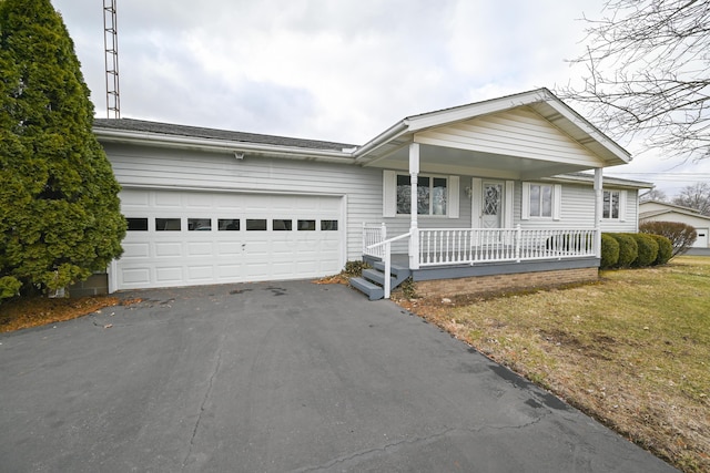 ranch-style home with a garage, driveway, and a porch