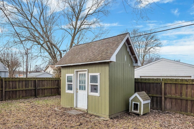 view of shed featuring a fenced backyard