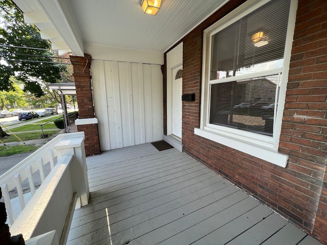 wooden terrace featuring a porch