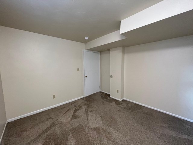 finished basement featuring carpet flooring and baseboards