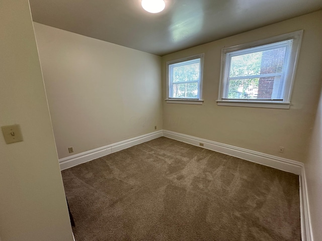 spare room with carpet floors and baseboards