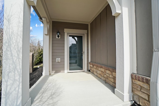 entrance to property with brick siding