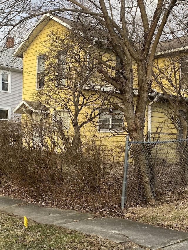 view of side of property with fence