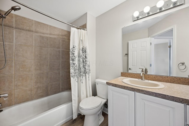 bathroom featuring shower / bathtub combination with curtain, toilet, and vanity