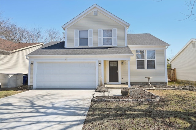 traditional-style home featuring concrete driveway, fence, a garage, and a shingled roof