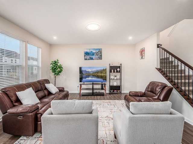 living room featuring recessed lighting, stairway, baseboards, and wood finished floors