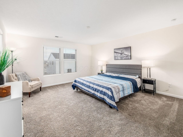 bedroom featuring carpet, visible vents, and baseboards