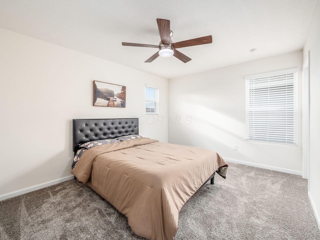 bedroom with carpet, baseboards, and ceiling fan