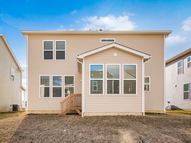 rear view of house featuring central AC unit