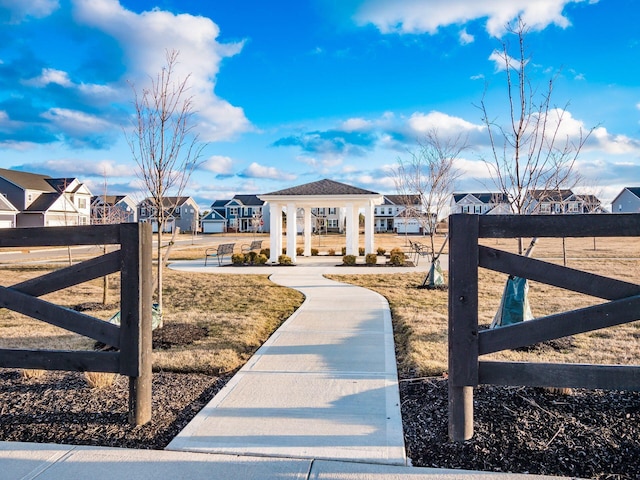 exterior space with fence and a residential view