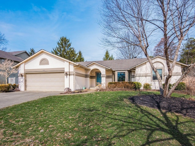 view of front of property with an attached garage, a front lawn, concrete driveway, and stucco siding