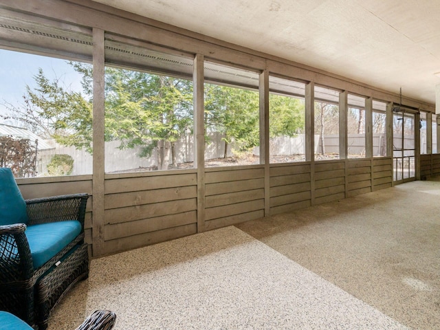 unfurnished sunroom featuring a healthy amount of sunlight