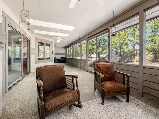 sunroom featuring a skylight and ceiling fan