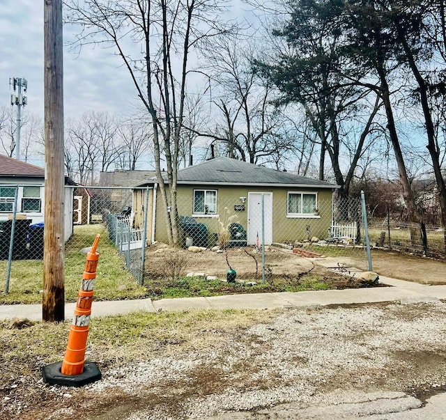 view of front of home featuring fence