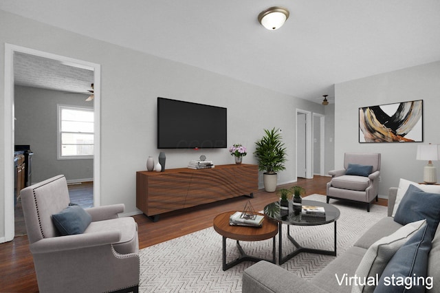 living area featuring wood finished floors and baseboards