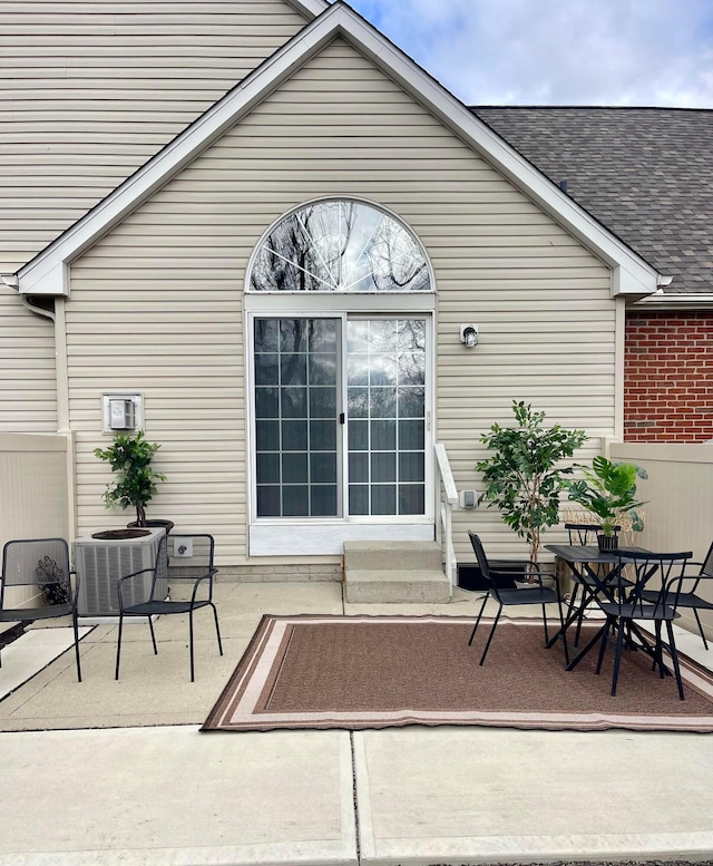 view of patio / terrace with central AC unit and outdoor dining space