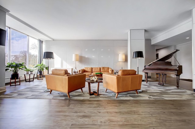 living room featuring a baseboard heating unit and wood finished floors