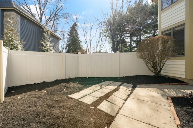 view of yard with a patio and a fenced backyard