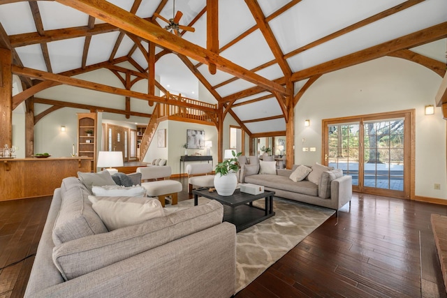 living area featuring ceiling fan, high vaulted ceiling, stairway, hardwood / wood-style floors, and beamed ceiling