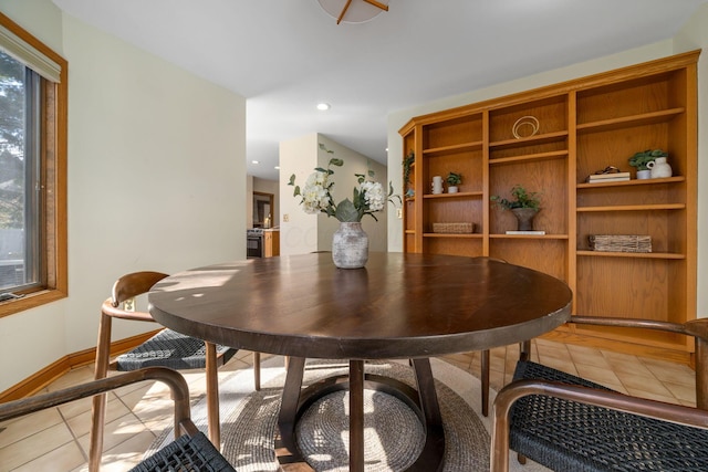 dining area featuring light tile patterned floors, recessed lighting, and baseboards