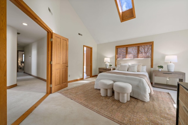 bedroom featuring light carpet, a skylight, baseboards, visible vents, and high vaulted ceiling