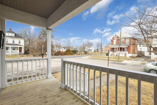 balcony featuring a residential view and a porch