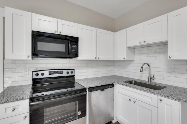 kitchen featuring electric stove, white cabinets, a sink, black microwave, and dishwasher