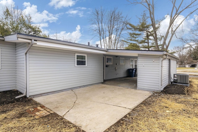 back of property featuring central AC and a patio