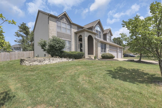 traditional-style home with an attached garage, fence, a front lawn, and brick siding