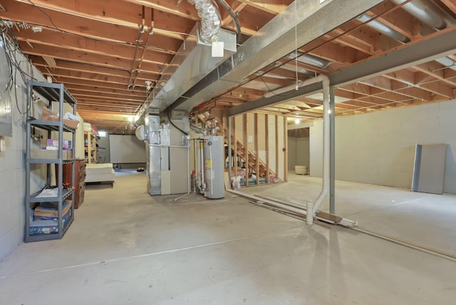 unfinished basement with water heater and heating unit