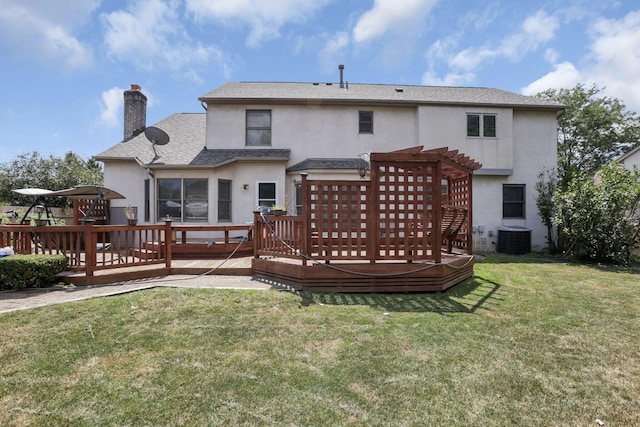 back of house featuring a chimney, a deck, a yard, central air condition unit, and stucco siding