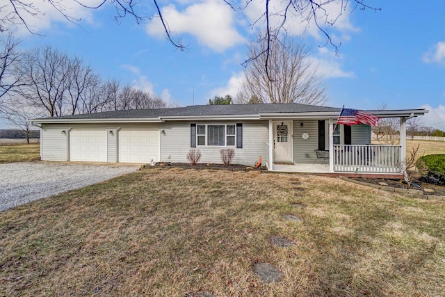 ranch-style home with a porch, a front yard, gravel driveway, and an attached garage