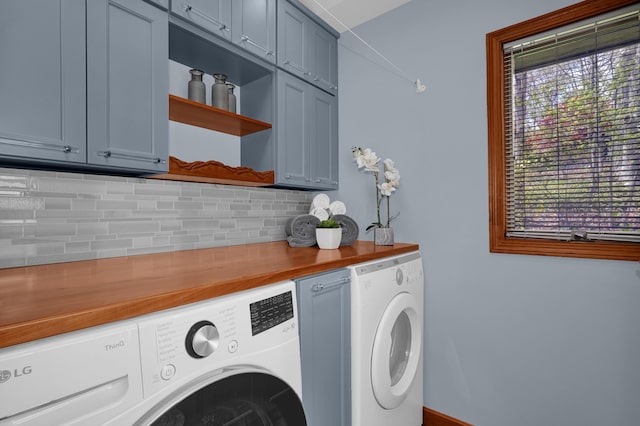 laundry room featuring cabinet space and independent washer and dryer