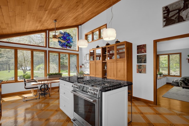 kitchen featuring high vaulted ceiling, wood ceiling, white cabinets, stainless steel gas range, and glass insert cabinets