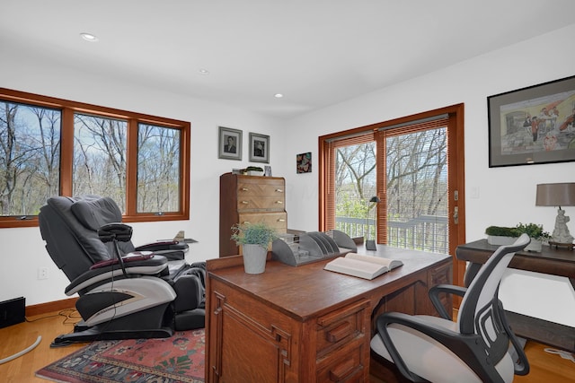 office space featuring baseboards, wood finished floors, and recessed lighting