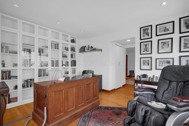 office area with recessed lighting, baseboards, and light wood finished floors