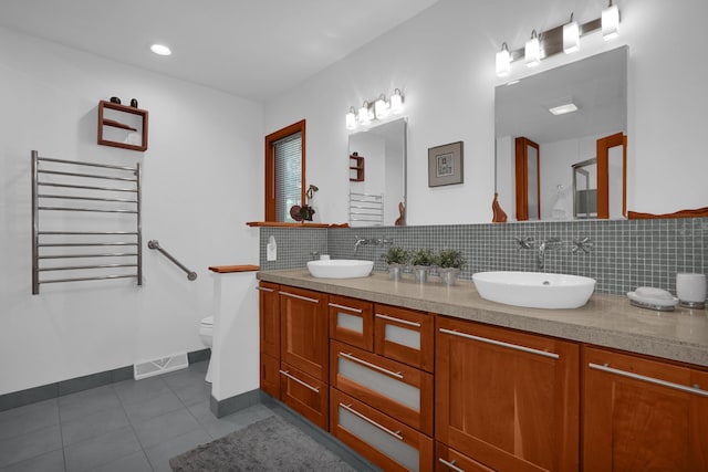 full bath featuring radiator heating unit, visible vents, a sink, and tile patterned floors