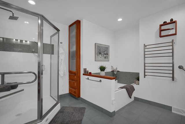 bathroom with a garden tub, recessed lighting, visible vents, a shower stall, and radiator heating unit