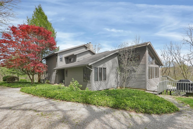 view of side of home featuring a deck